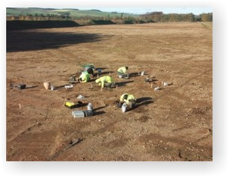 ARS staff member digging at Lanton Quarry