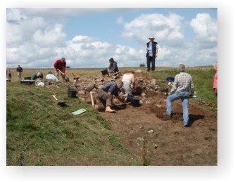 Volunteers helping to dig the rampart ditch at Fin Cop hillfort
