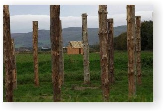 A view of the Dark Age house through the henge
