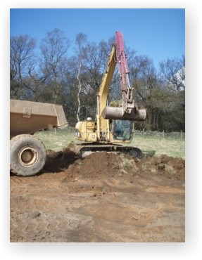 A watching brief being carried out during the removal of topsoil on a site