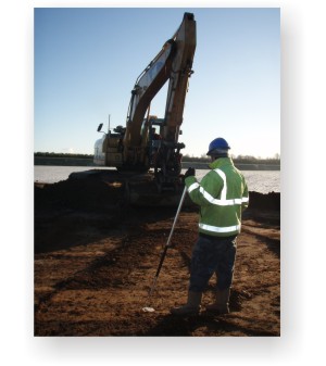 The topsoil being stripped from the site by a mechanical digger