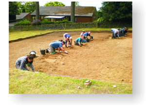 Volunteers trowelling across the west entrance into the enclosure.