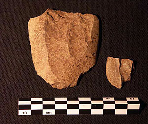 Two fragments of tuff from a re-chipped Neolithic stone axe head