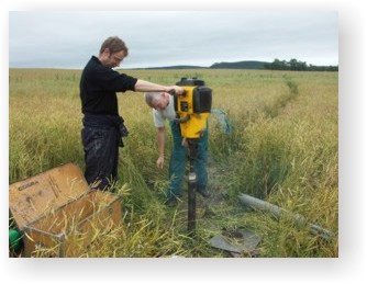 An auger is used to extract sedment cores from the ground