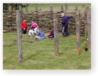 Children helping with reconstructions at the Maelmin Heritage Trail