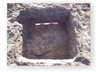 A test pit that was opened at Lanton Quarry as the result of the discovery of a flint cache