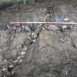 Two of the numerous field drains found criss-crossing the site during the evaluation (scale = 2m). © Copyright ARS Ltd