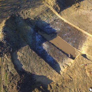 A drone photograph of the kettle hole showing the upper levels of the Mesolithic timber platform. © Copyright ARS Ltd